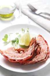 Photo of Delicious boiled lobster served on white table, closeup