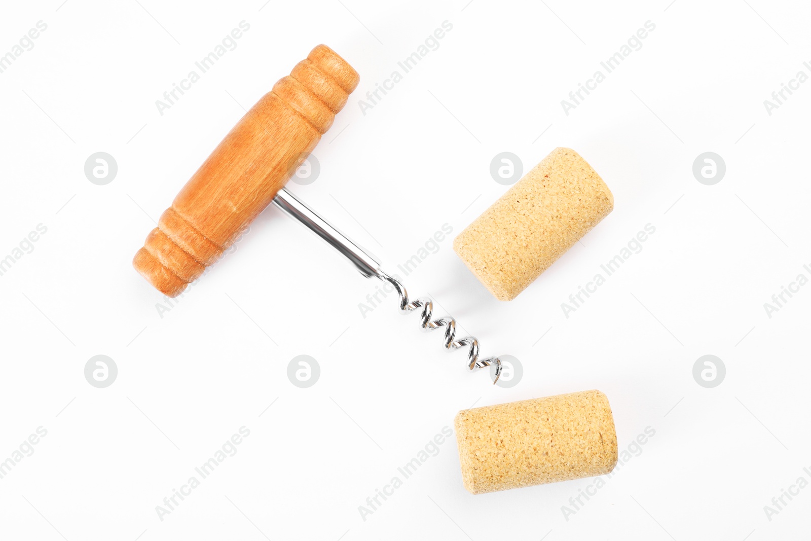 Photo of Corkscrew and corks on white background, top view