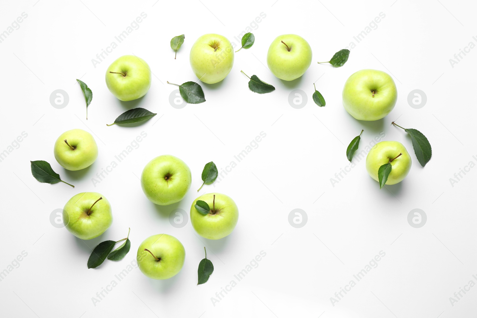 Flat lay composition with fresh apples and green leaves on white background Photo of Flat lay composition with fresh apples and green leaves on white background