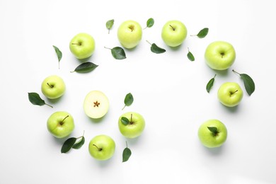 Photo of Flat lay composition with fresh apples and green leaves on white background