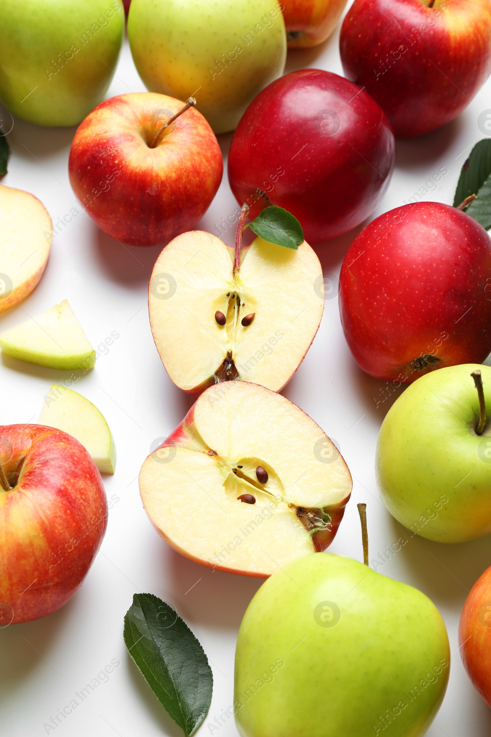 Photo of Flat lay composition with whole and cut apples on white background