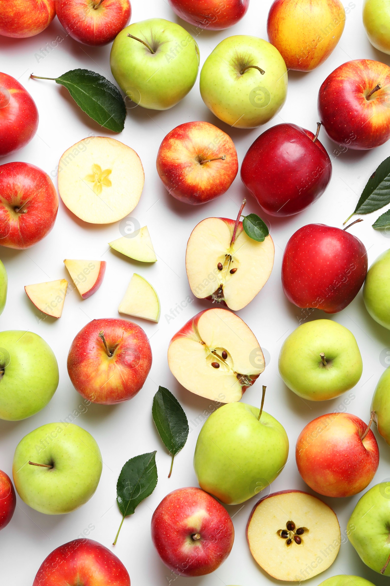 Photo of Flat lay composition with whole and cut apples on white background