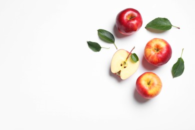 Photo of Flat lay composition with whole and cut apples on white background. Space for text