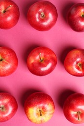 Photo of Fresh ripe red apples on pink background, flat lay