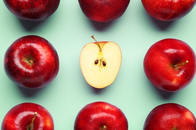 Photo of Fresh ripe red apples on light blue background, flat lay