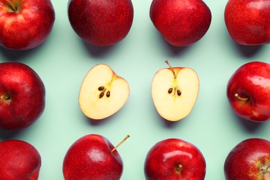 Photo of Fresh ripe red apples on light blue background, flat lay