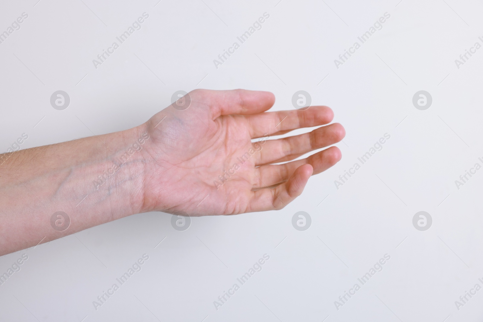 Photo of Woman with visible hand veins on white background, closeup