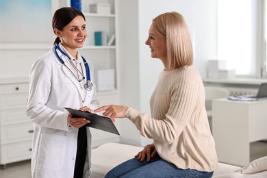 Woman having appointment with doctor in hospital