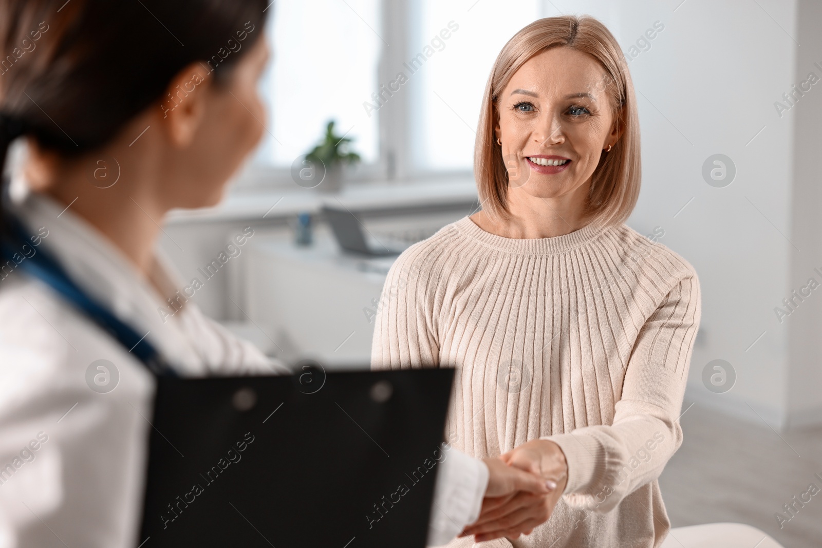 Photo of Woman having appointment with doctor in hospital