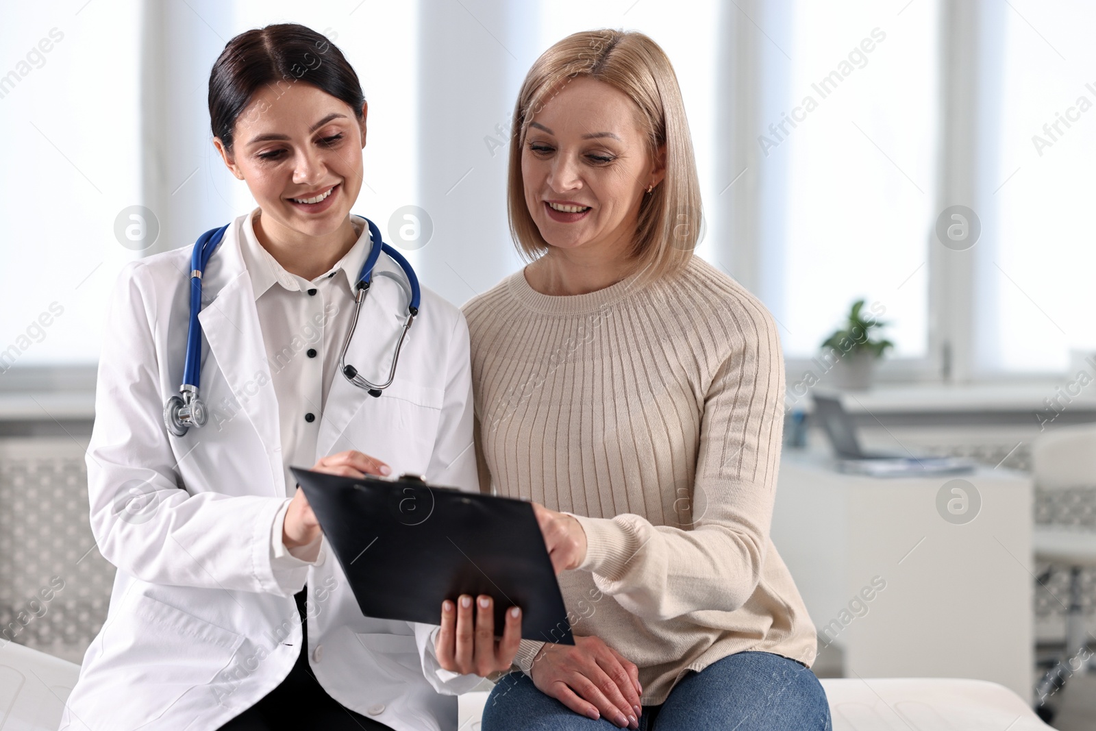 Photo of Woman having appointment with doctor in hospital