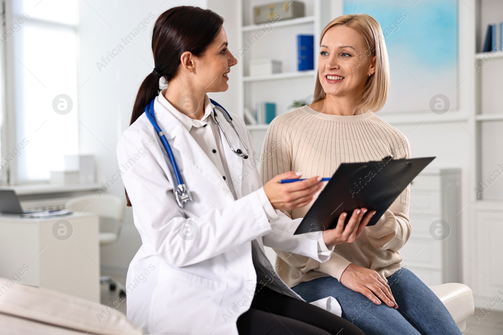 Photo of Woman having appointment with doctor in hospital