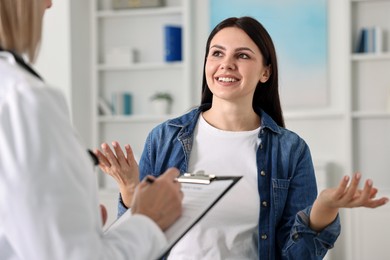 Photo of Woman having appointment with doctor in hospital