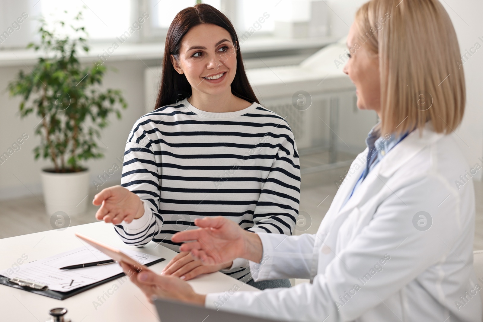 Photo of Woman having appointment with doctor in hospital