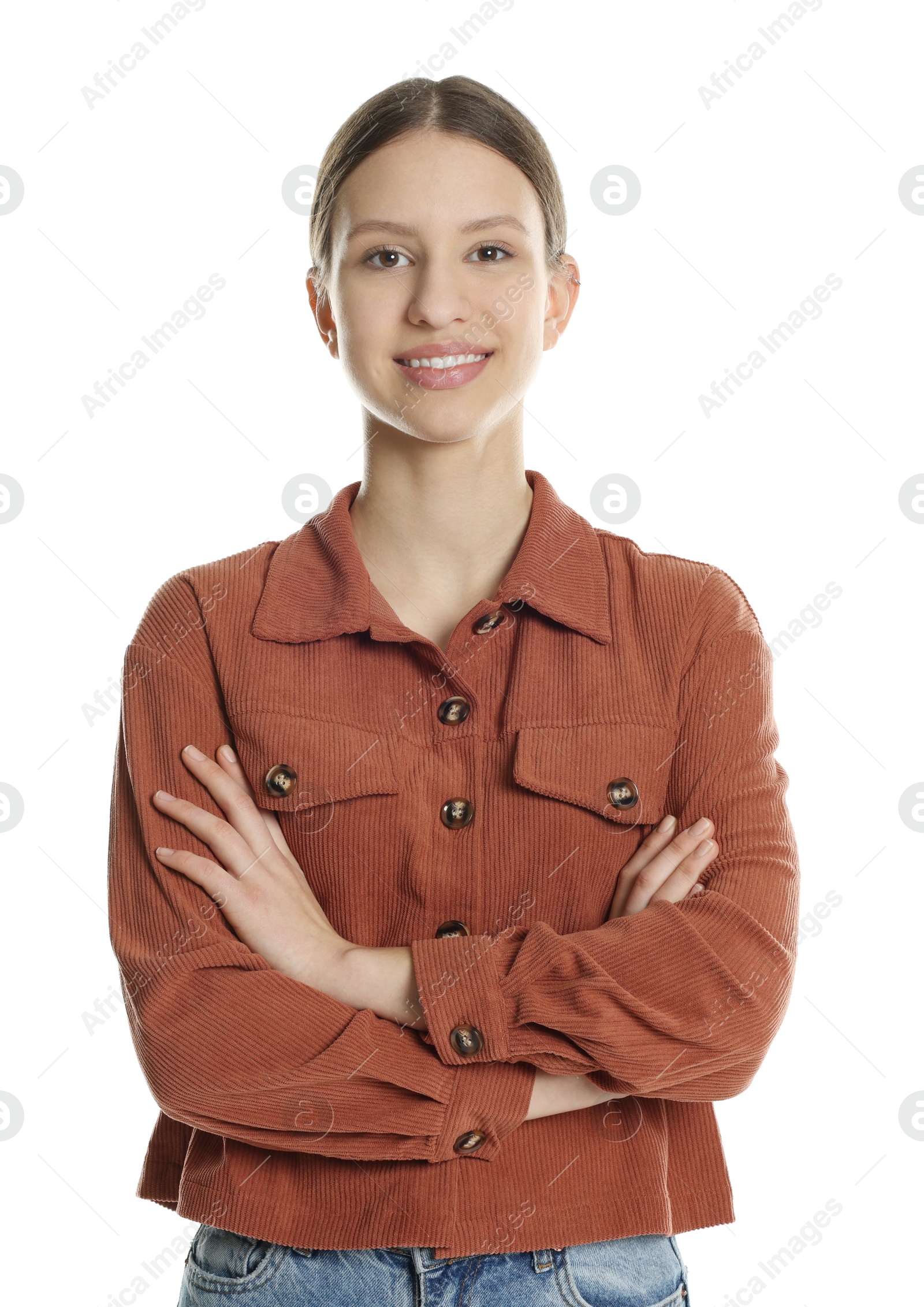 Photo of Portrait of smiling teenage girl with crossed arms on white background