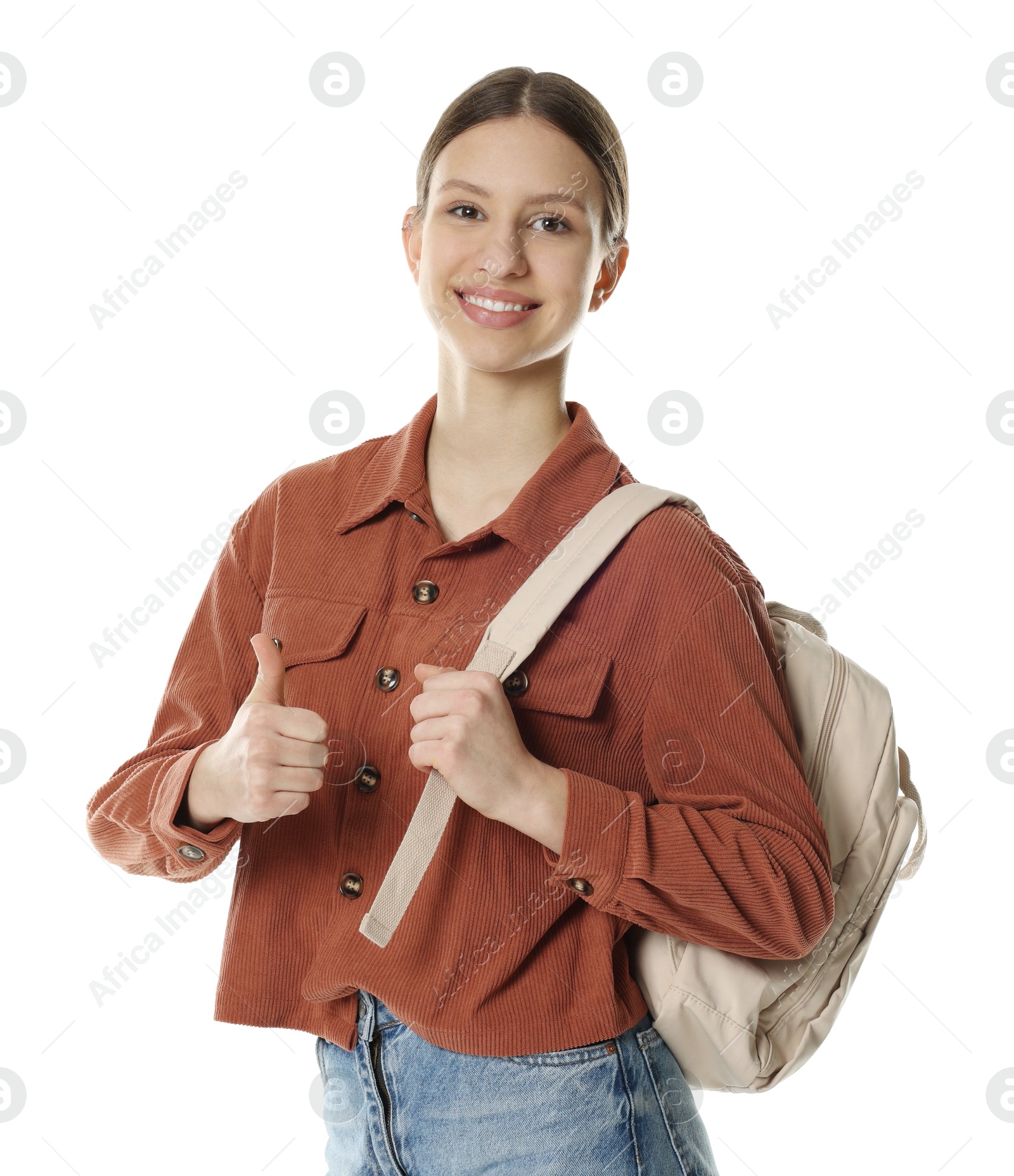 Photo of Portrait of smiling teenage girl with backpack showing thumbs up on white background