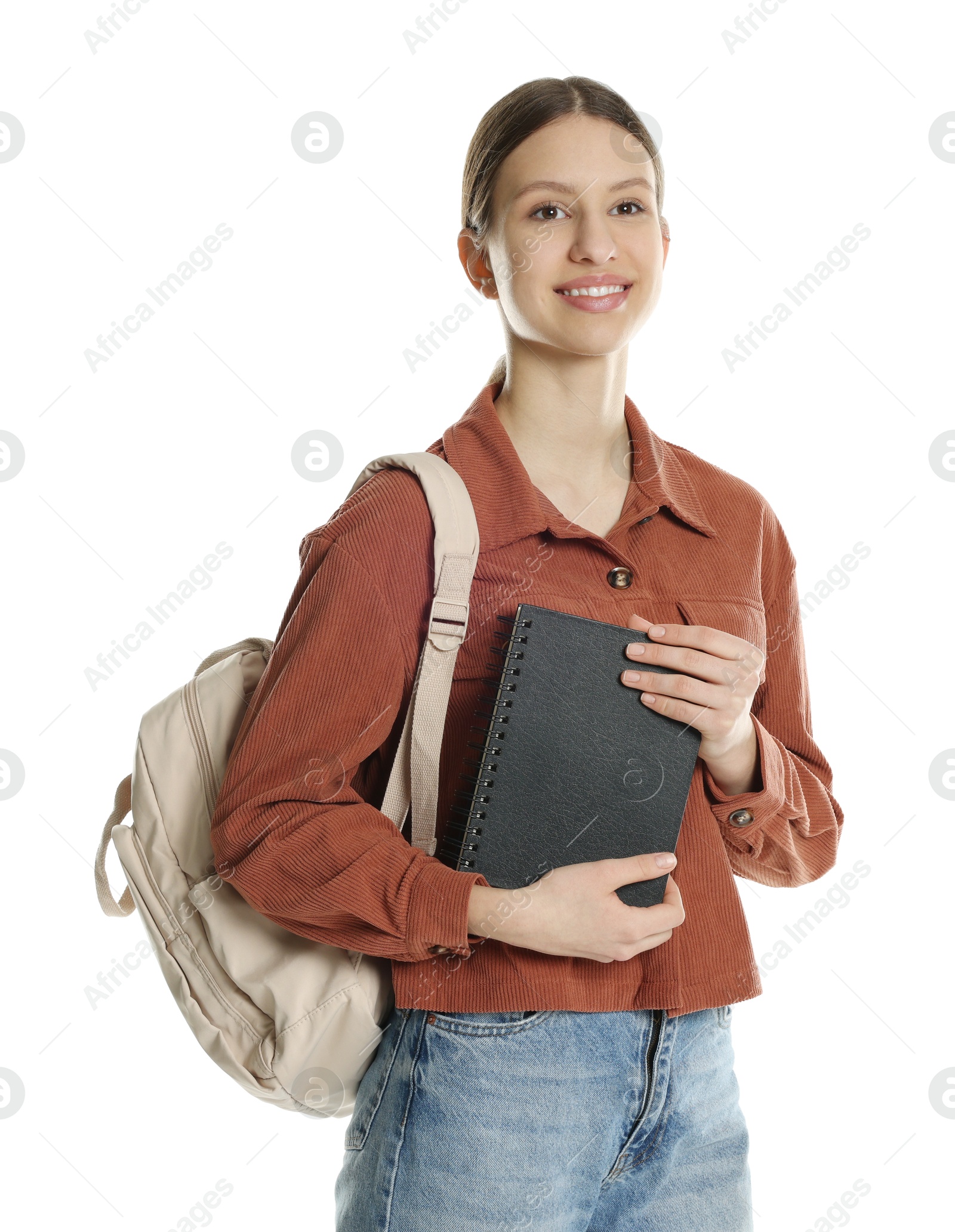 Photo of Portrait of smiling teenage girl with notepad and backpack on white background