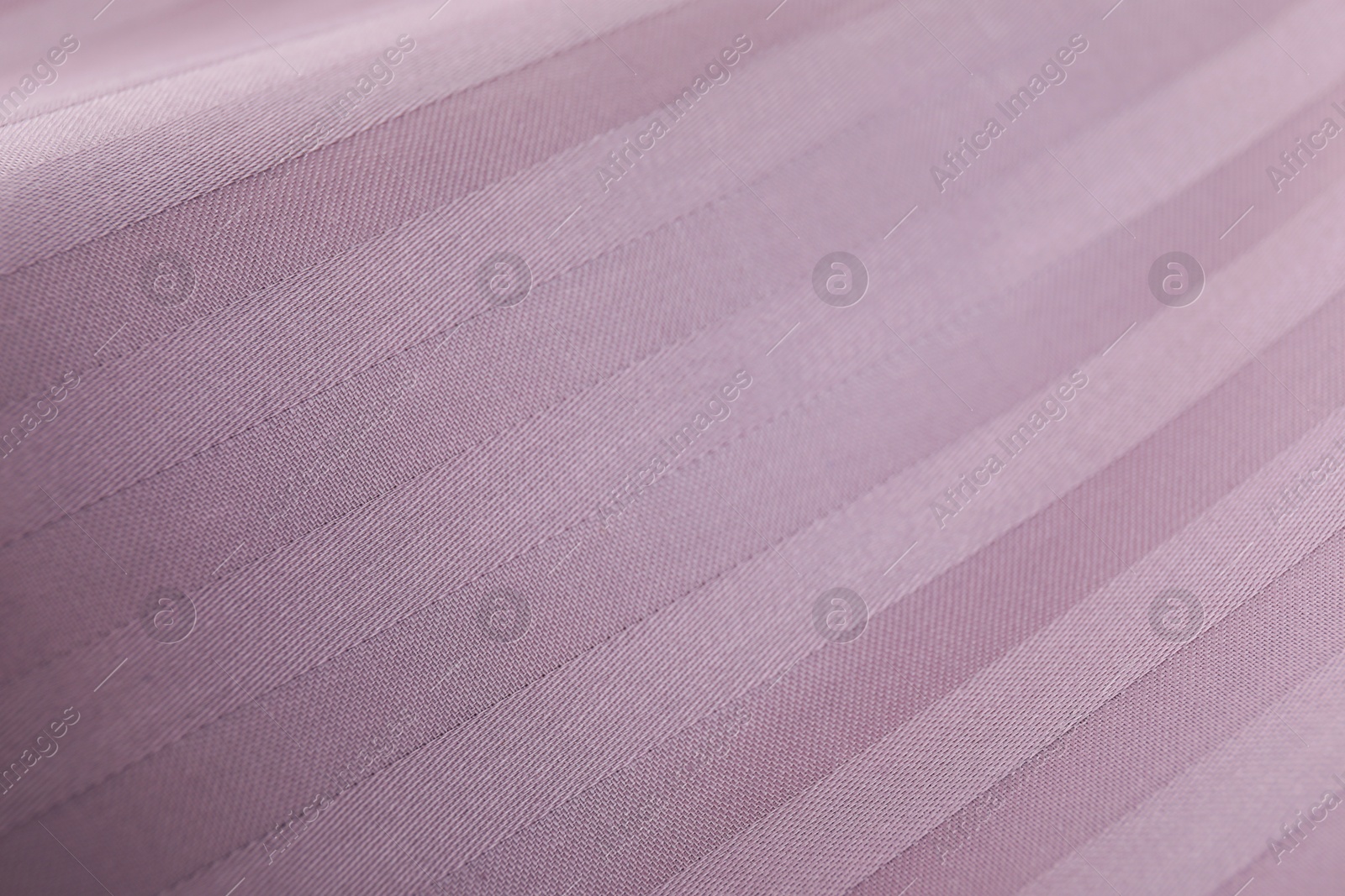 Photo of Texture of clean violet pillowcase as background, top view