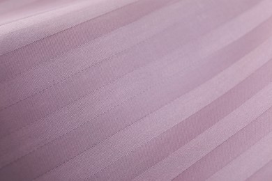 Photo of Texture of clean violet pillowcase as background, top view