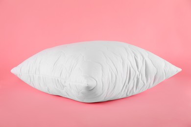 Photo of Pillow with clean pillowcase on pink background