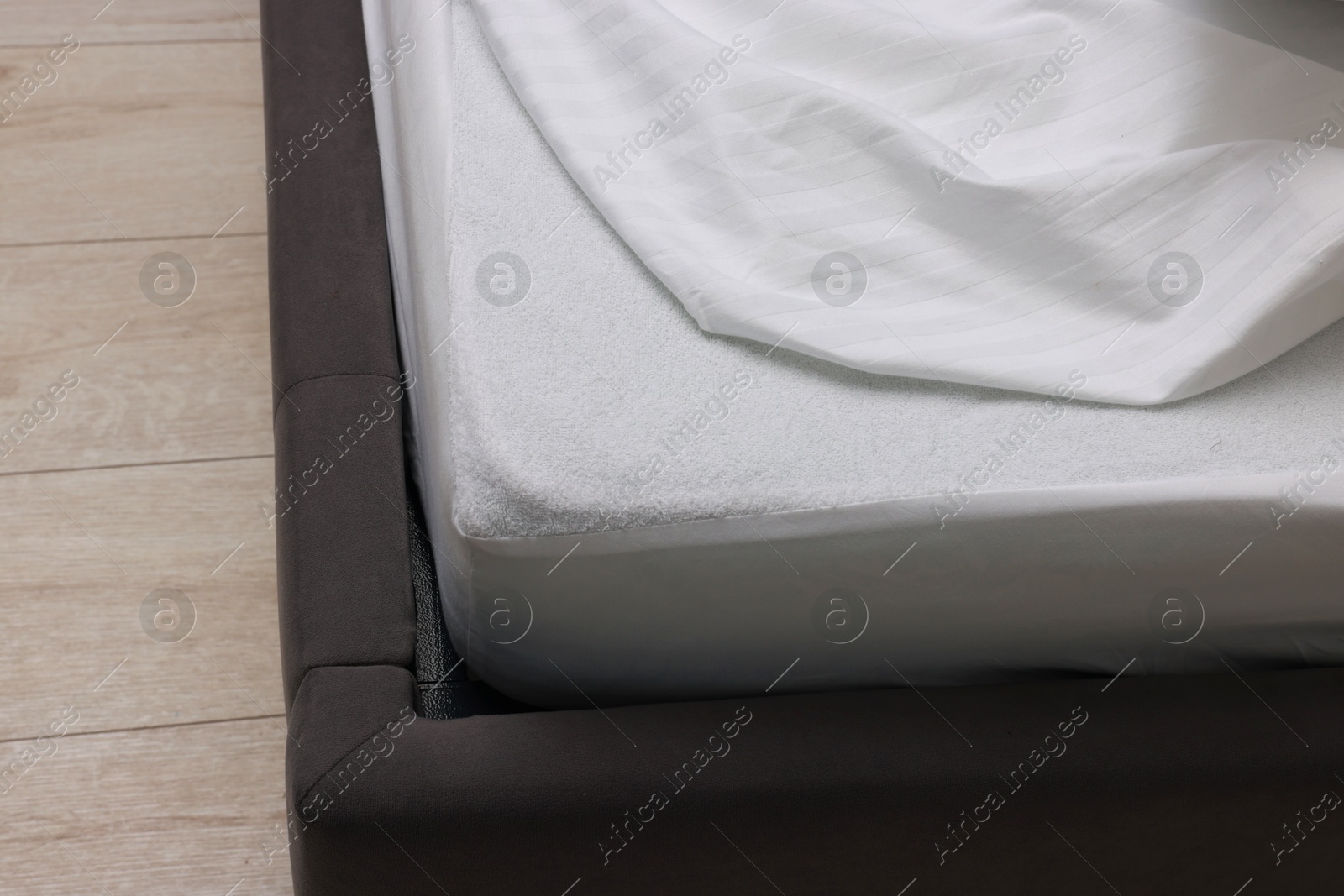 Photo of Bed with clean linens at home, closeup