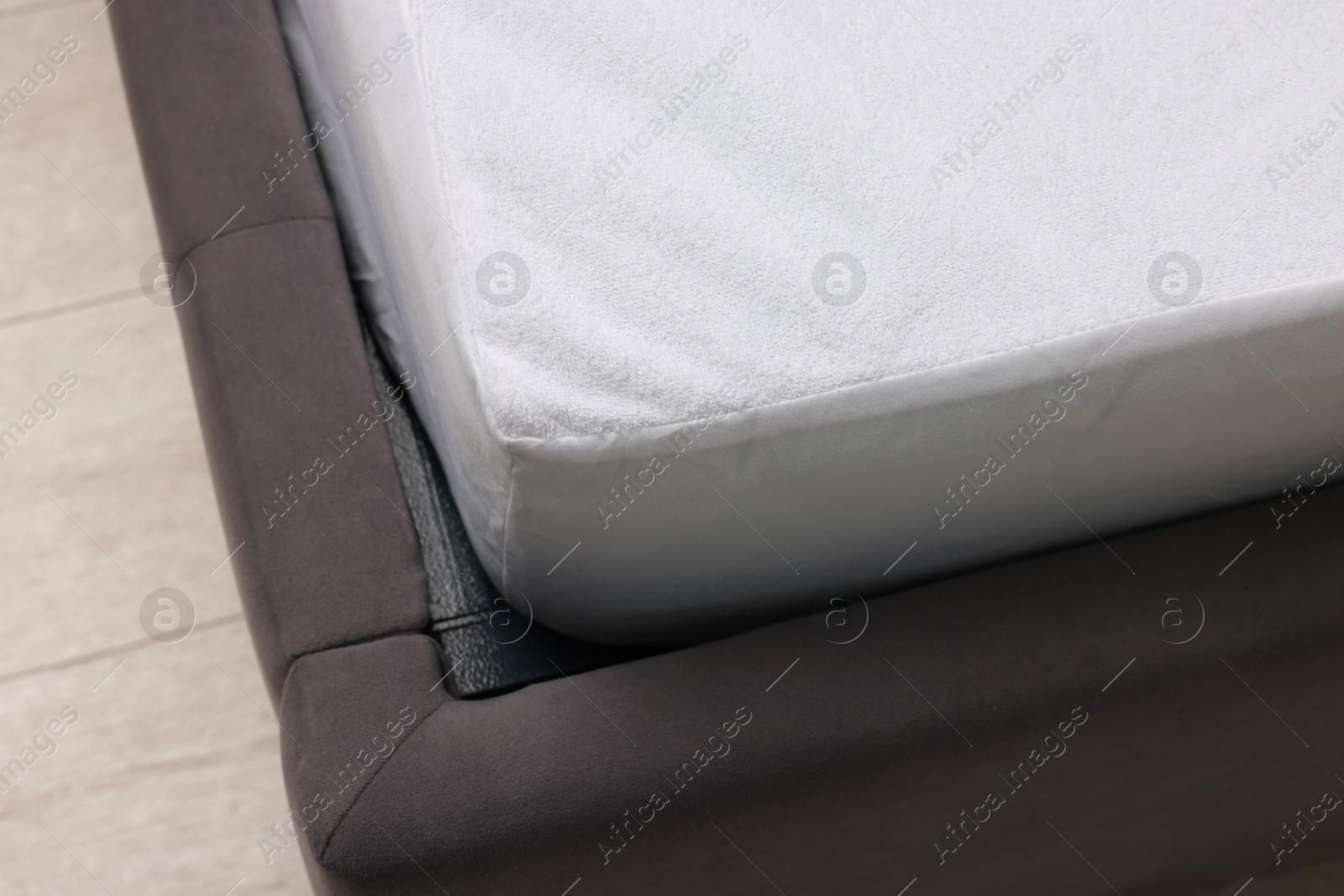 Photo of Bed with clean linens at home, closeup