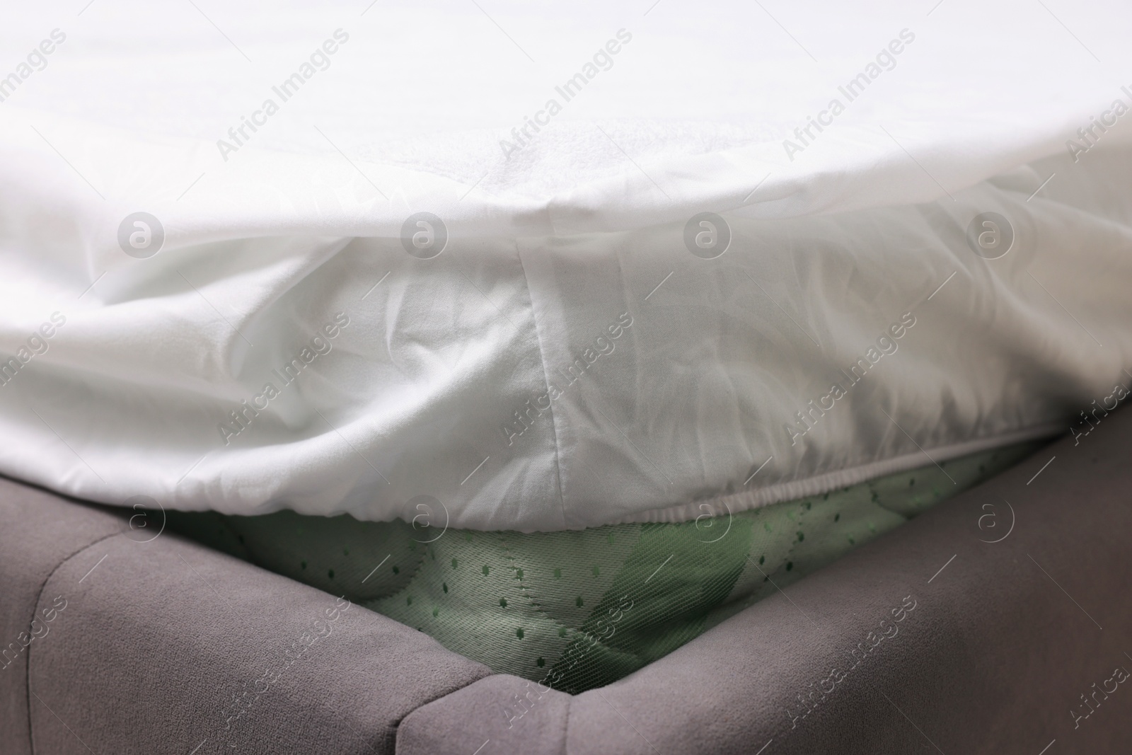 Photo of Bed with white clean linens at home, closeup