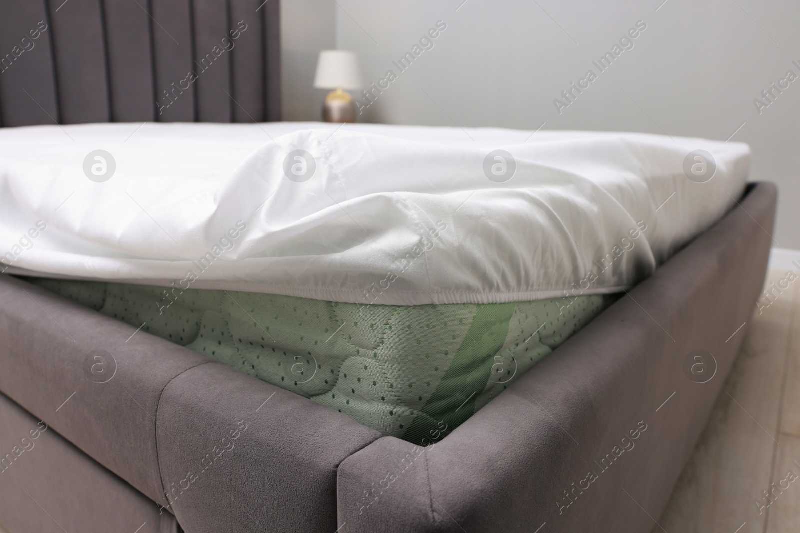 Photo of Bed with white clean linens at home, closeup