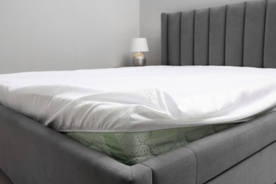 Photo of Bed with white clean linens at home, closeup