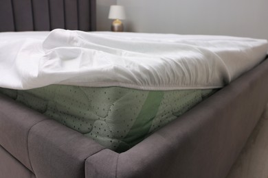 Photo of Bed with white clean linens at home