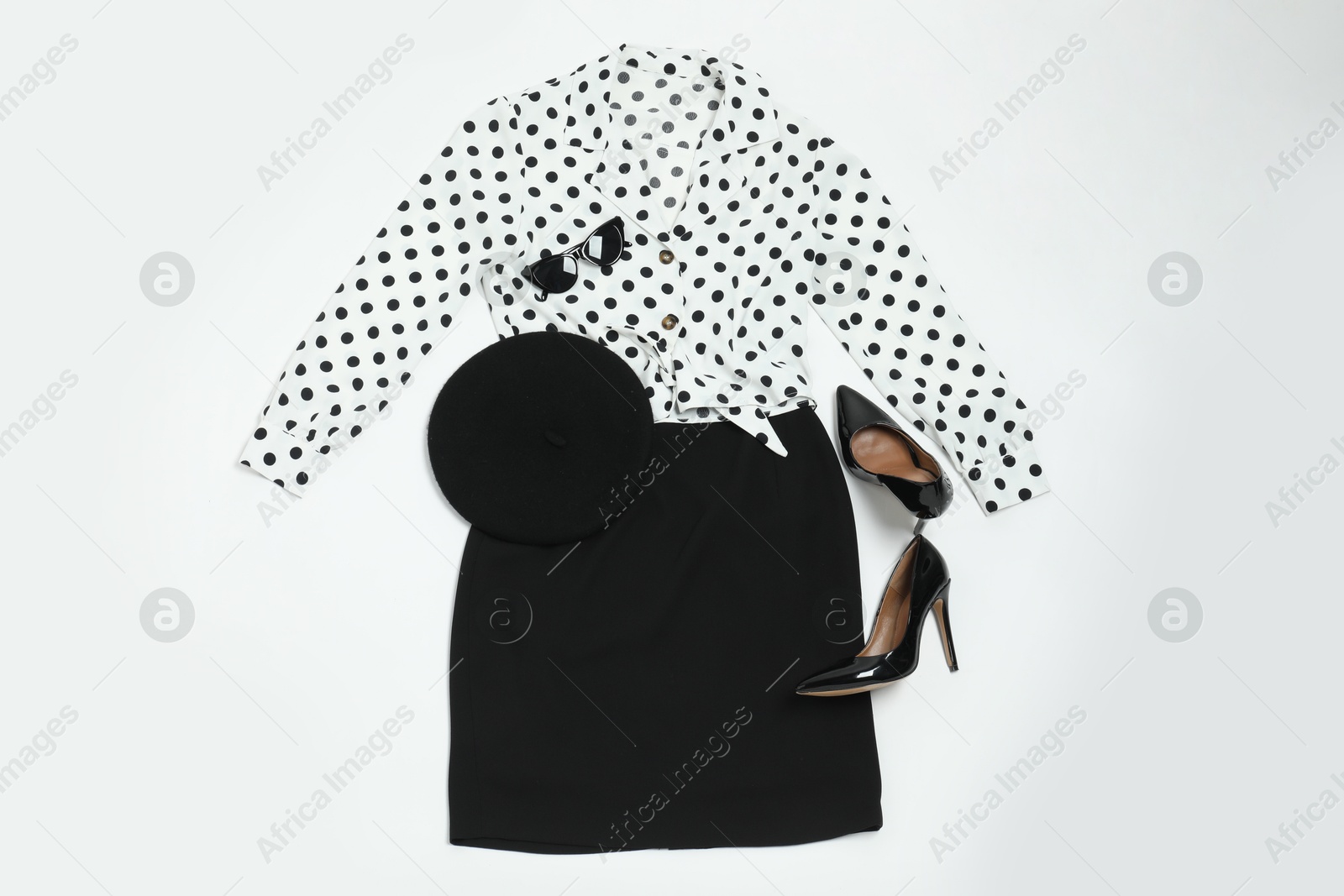 Photo of Retro styled outfit on white background, flat lay