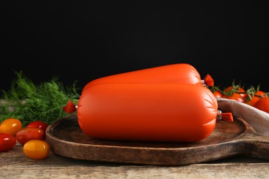 Photo of Tasty boiled sausages, tomatoes and dill on wooden table