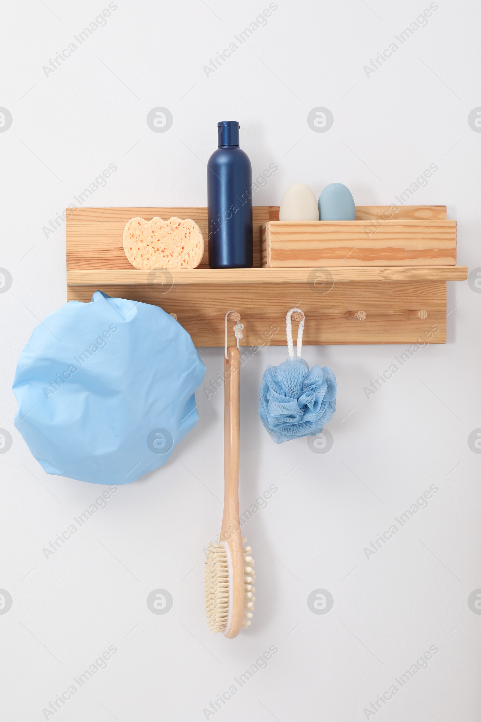 Photo of Shower cap and bath accessories on rack indoors