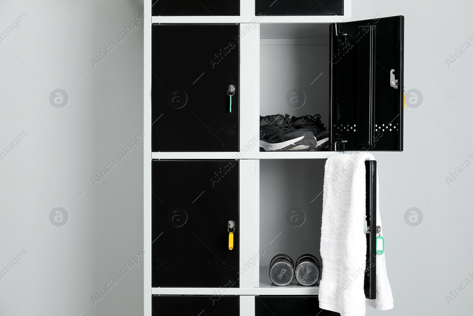 Photo of Lockers with personal belongings in changing room at gym