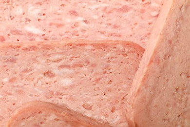 Photo of Pieces of canned meat as background, closeup