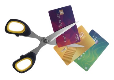 Photo of Credit cards and scissors isolated on white