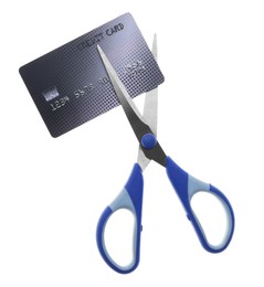 Photo of Credit card and scissors isolated on white