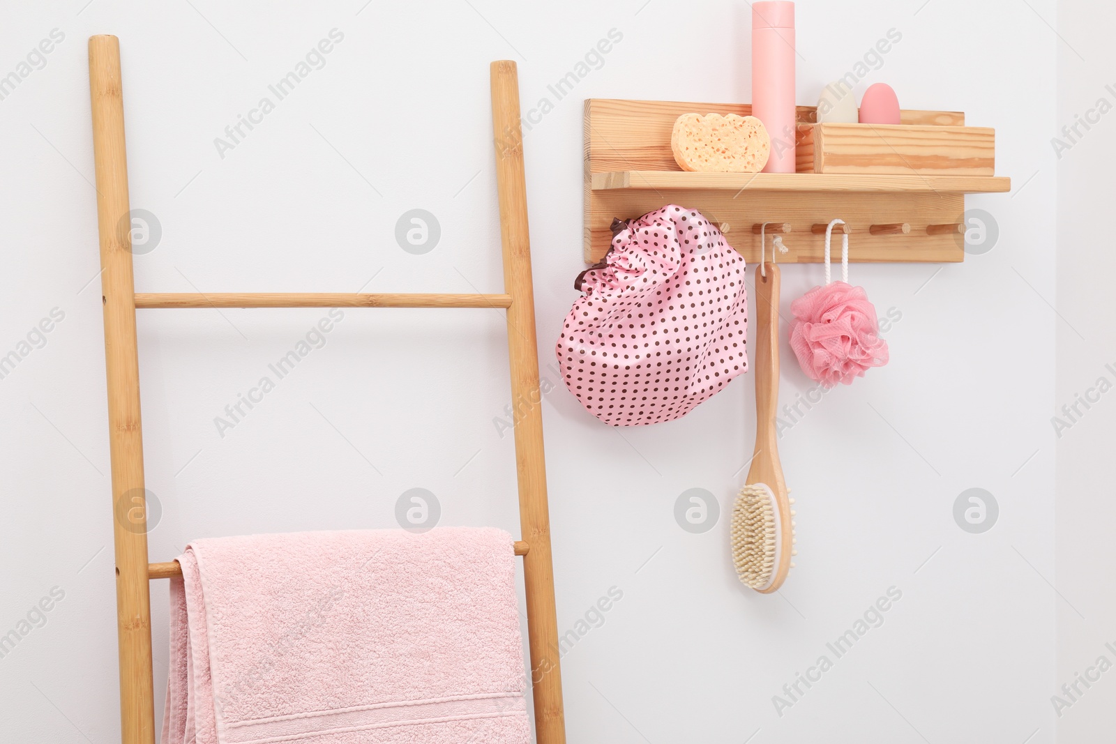 Photo of Shower cap and bath accessories in bathroom