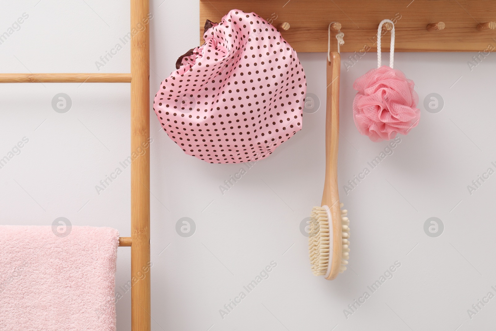 Photo of Shower cap and bath accessories in bathroom