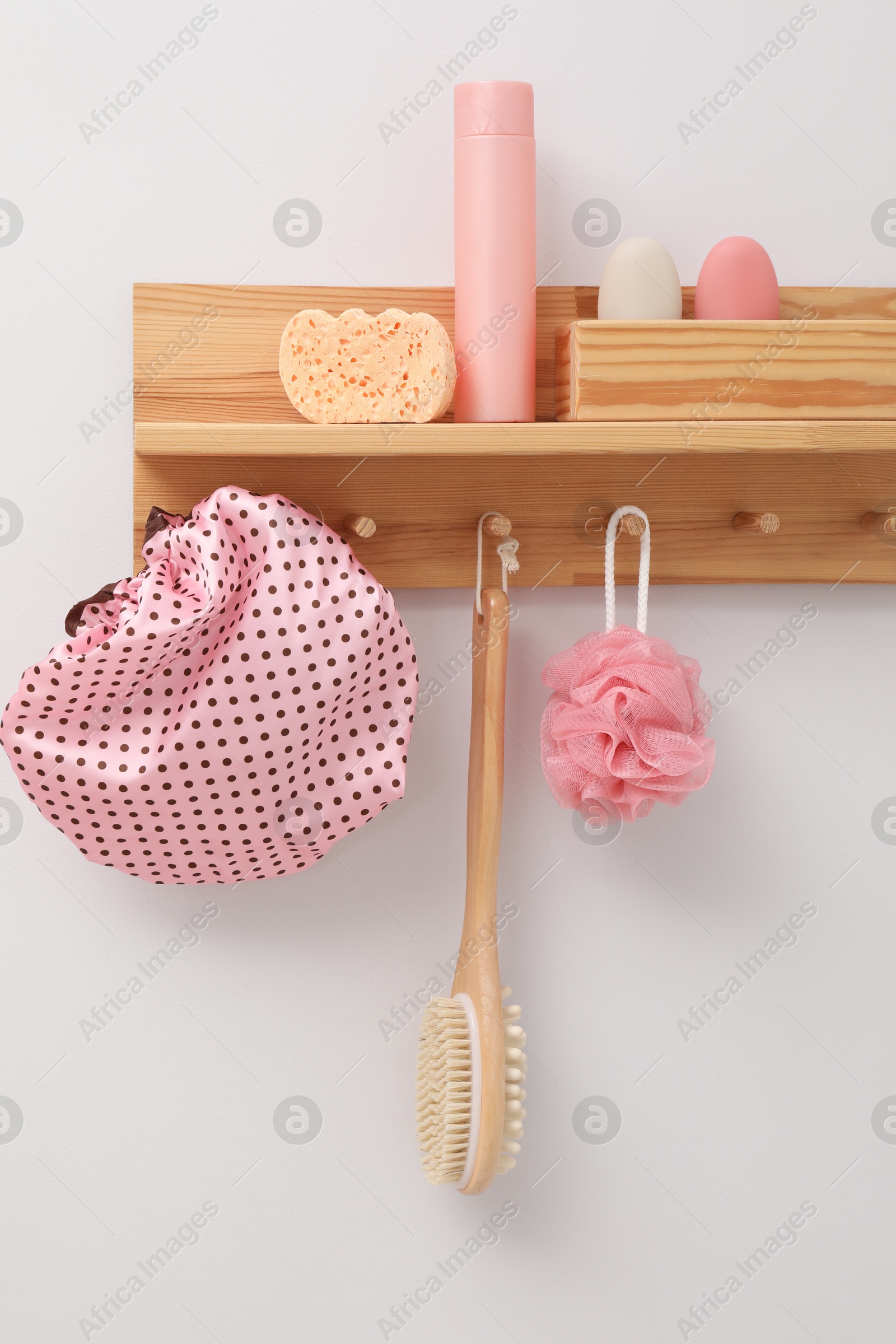 Photo of Shower cap and bath accessories in bathroom