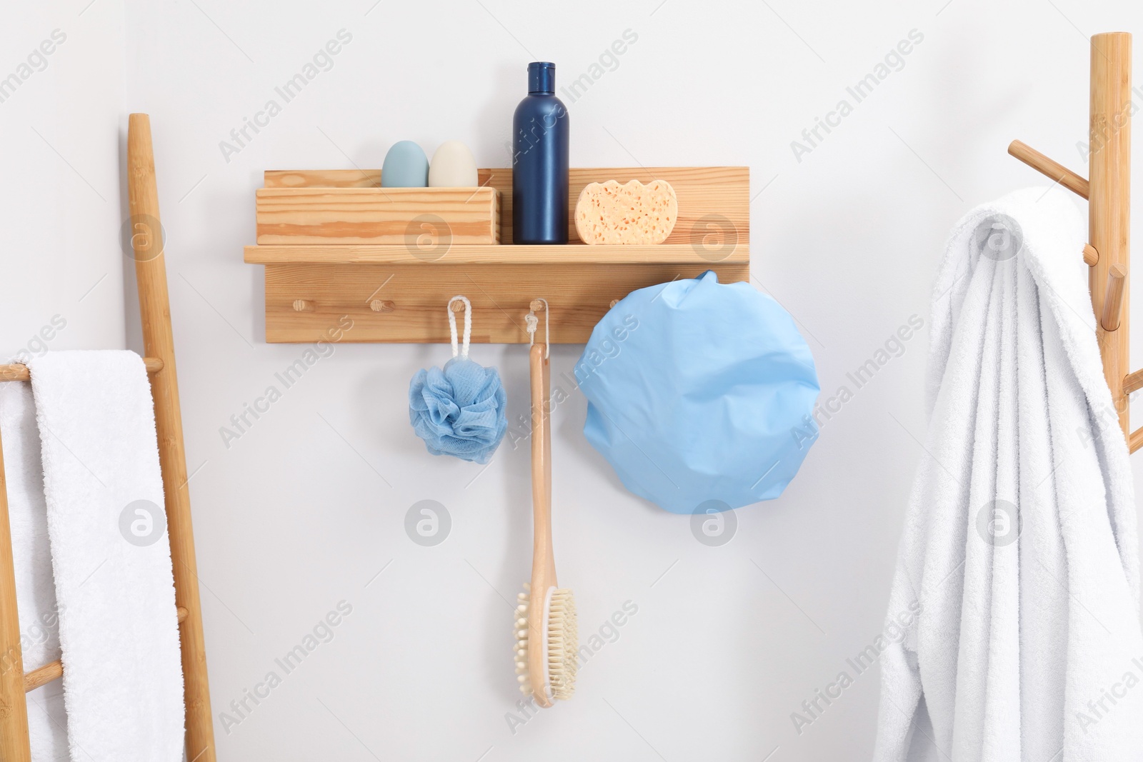 Photo of Shower cap and bath accessories on rack indoors