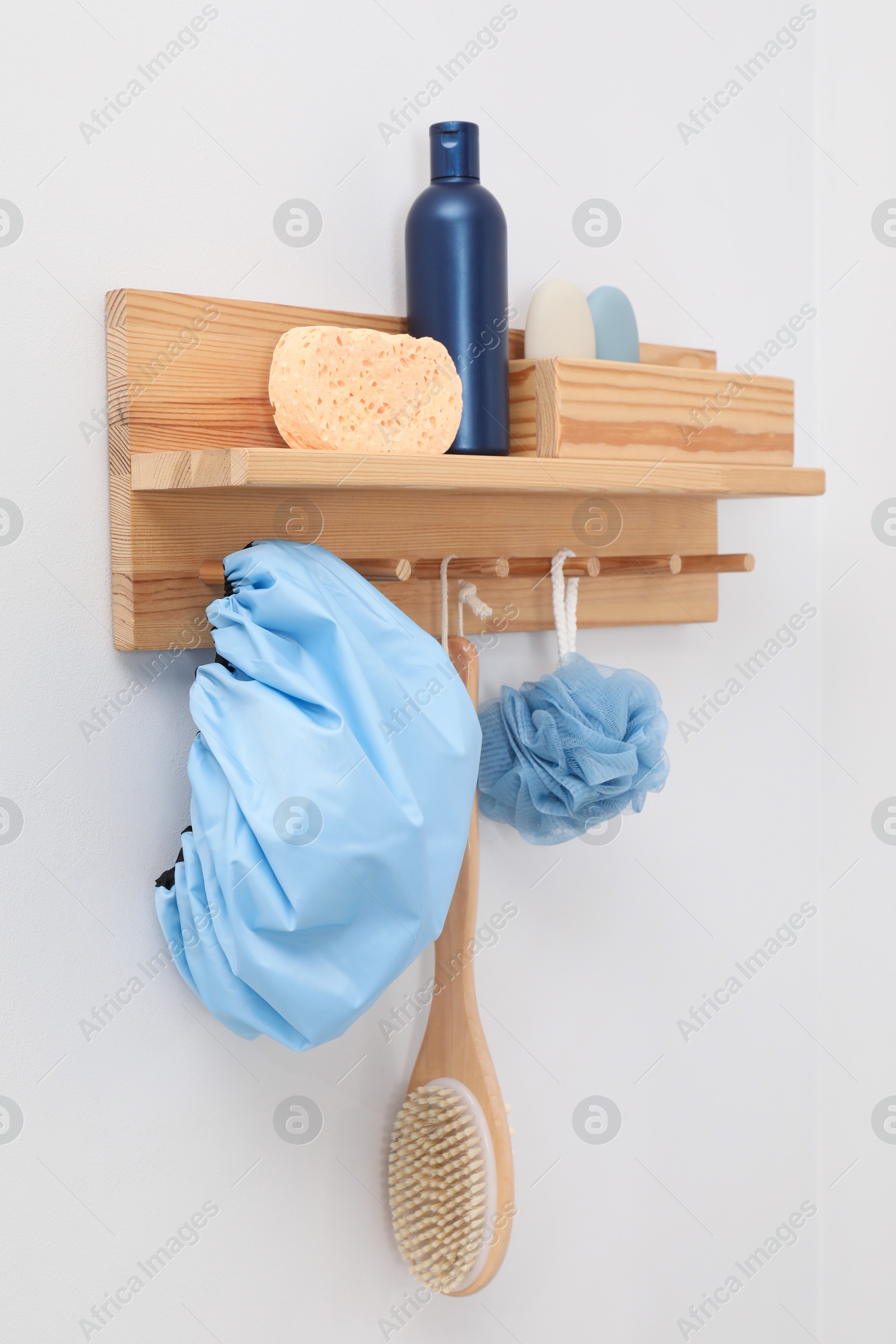 Photo of Shower cap and bath accessories on rack indoors