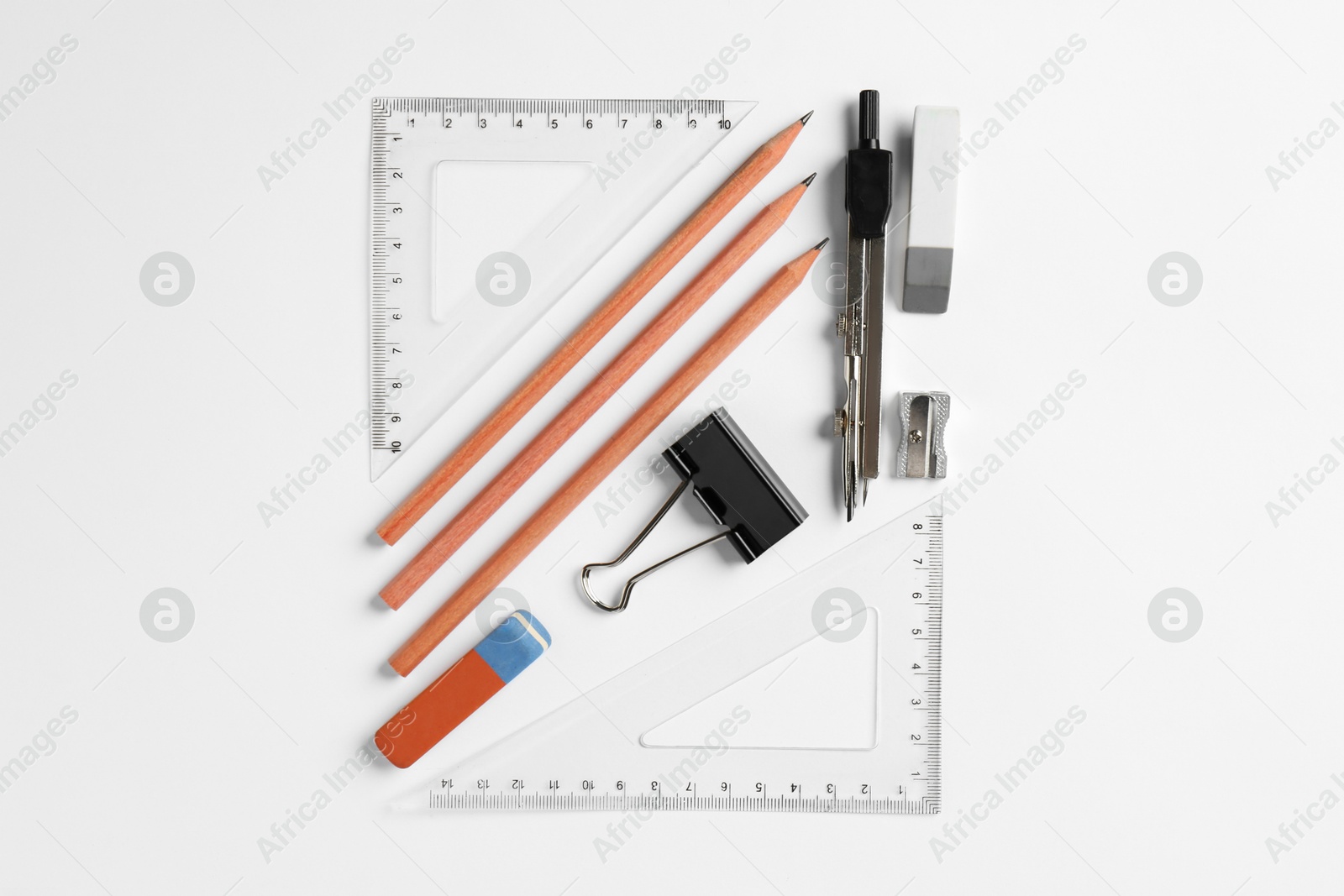 Photo of Flat lay composition with ruler and other stationery on white background