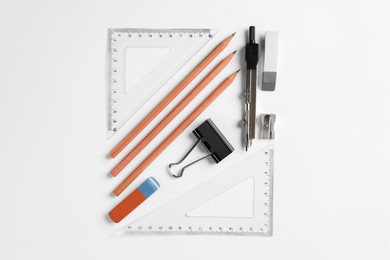 Photo of Flat lay composition with ruler and other stationery on white background