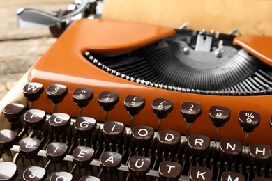 Photo of Old vintage typewriter machine on table, closeup