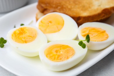 Photo of Hard boiled eggs on light table, closeup