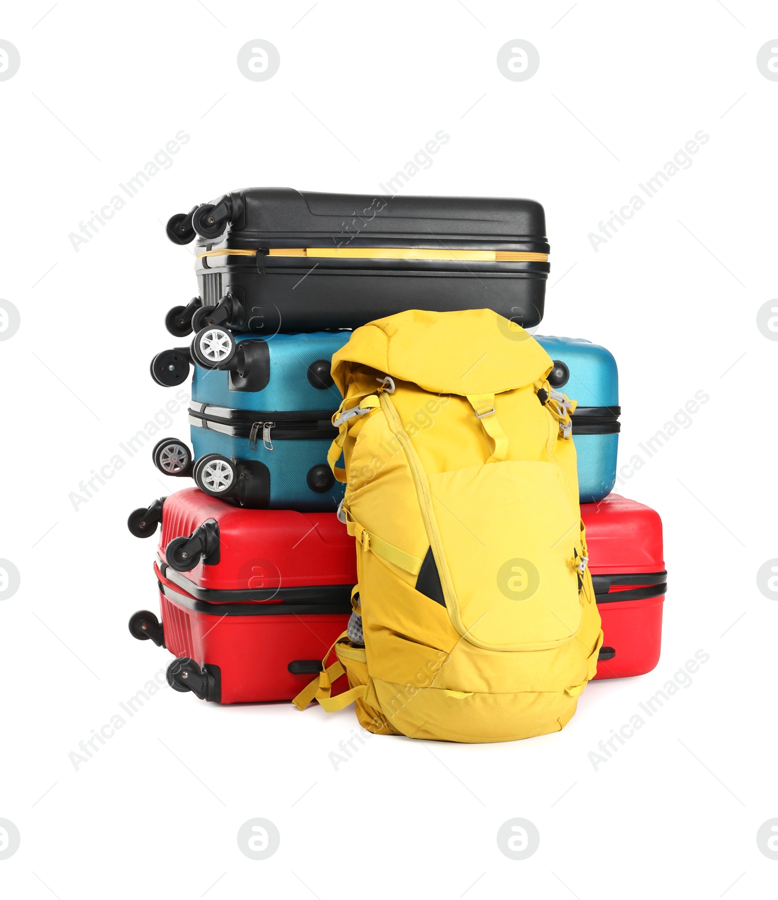 Photo of Stack of colorful suitcases and backpack isolated on white