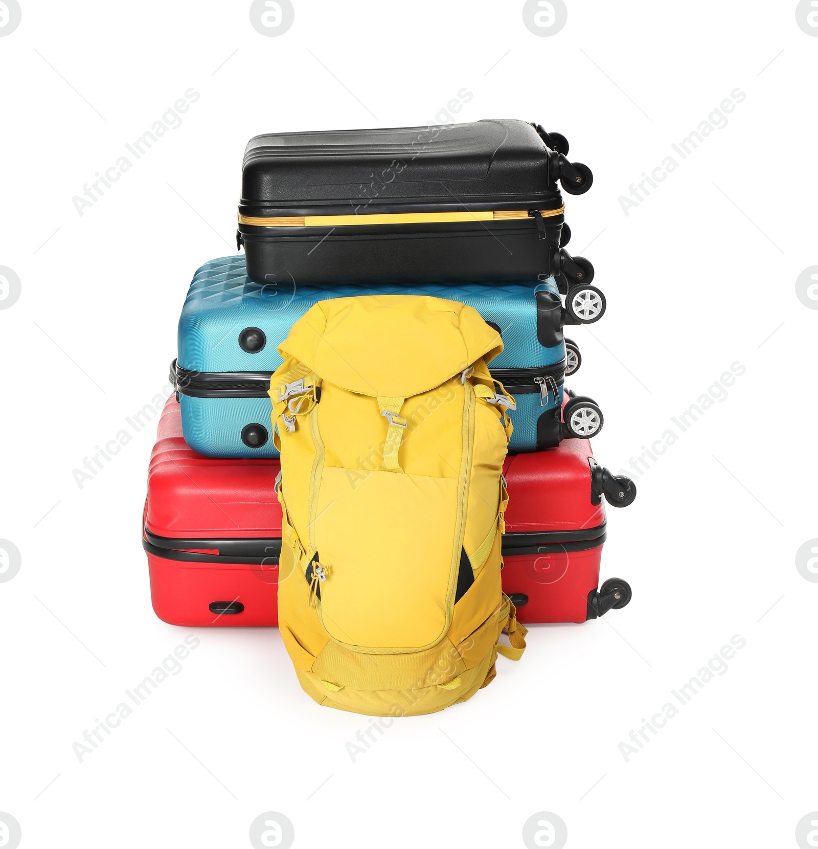 Photo of Stack of colorful suitcases and backpack isolated on white