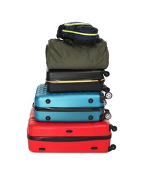 Photo of Stack of colorful suitcases, bag and backpack isolated on white