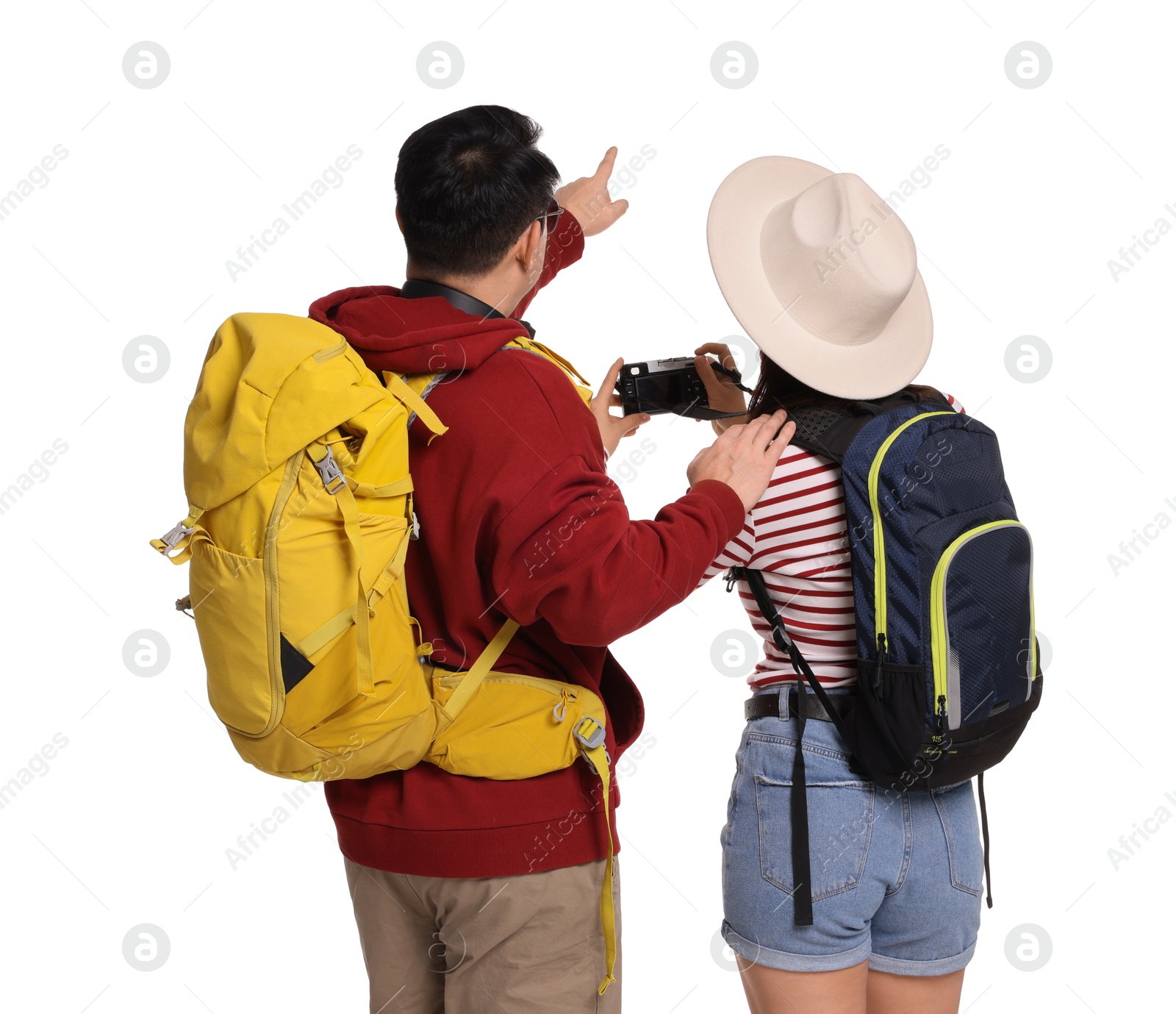 Photo of Travellers with backpacks taking photo on white background, back view