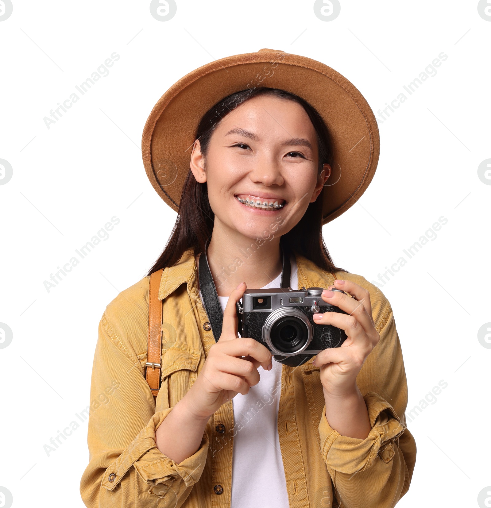 Photo of Happy traveller with camera on white background